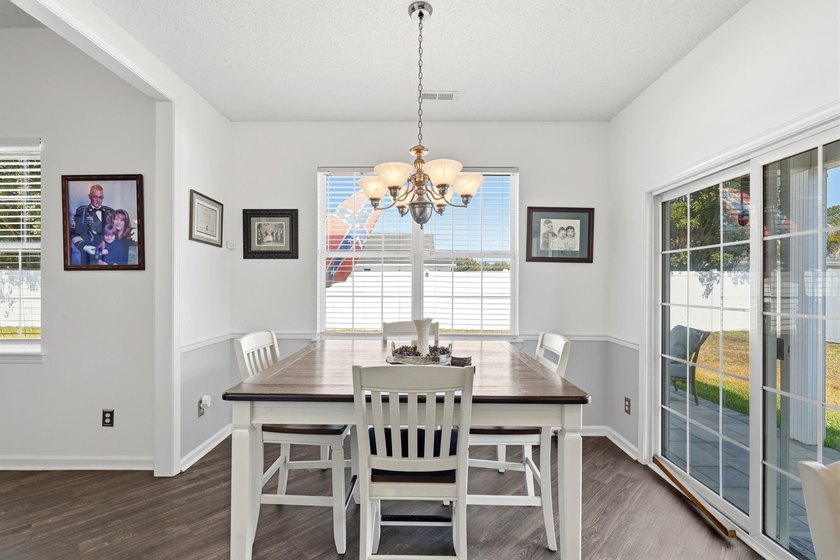 Welcome to this charming 3-bedroom, 2-bath home offering an - photo 7