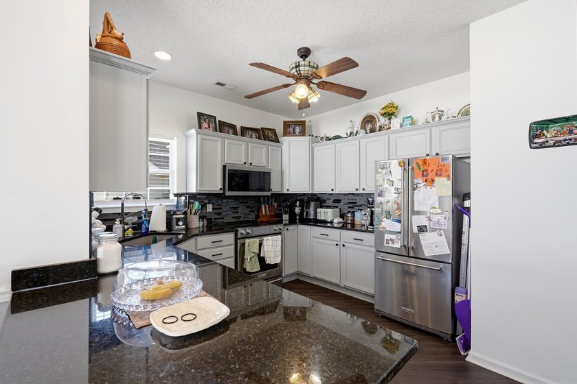 Welcome to this charming 3-bedroom, 2-bath home offering an - photo 9