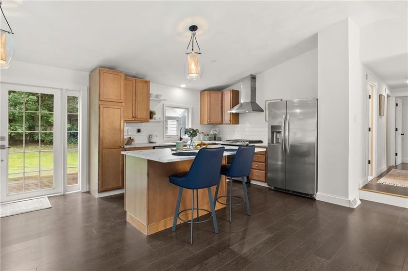 Tucked away in a peaceful setting, this three-bedroom - photo 7