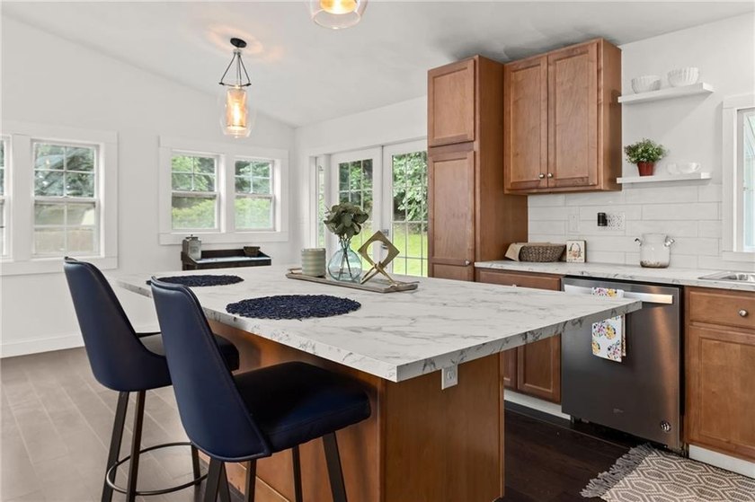 Tucked away in a peaceful setting, this three-bedroom - photo 9