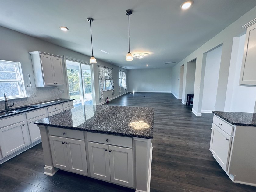 This Westerly home is a unique plan with a formal living and - photo 5