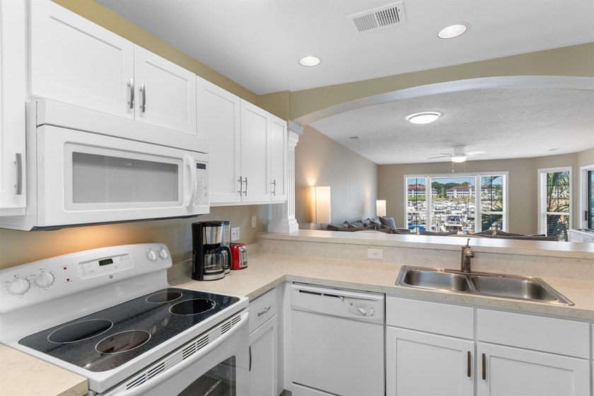 Wake up to beautiful marina views from this partially furnished - photo 7
