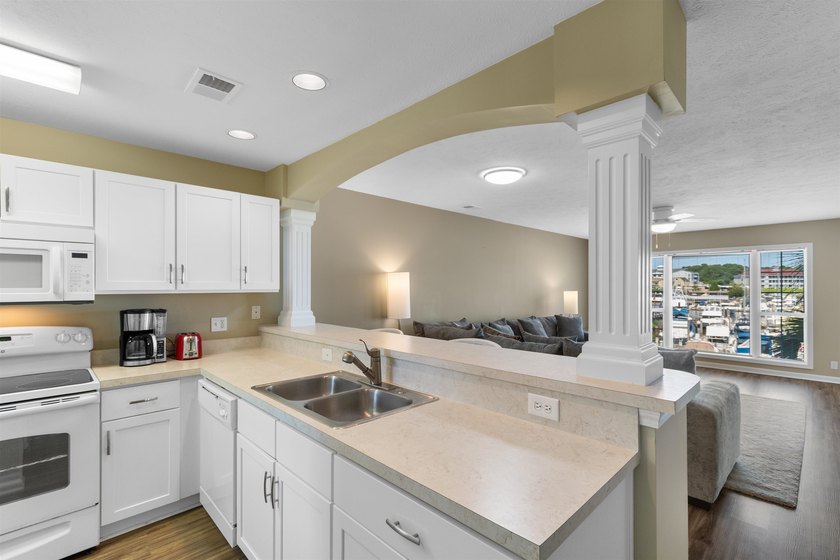 Wake up to beautiful marina views from this partially furnished - photo 9
