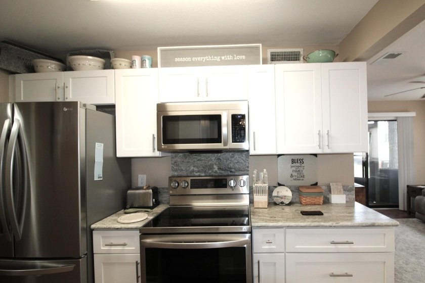 This ground floor 2BR/2BA, end-unit is located in the Tall Oaks - photo 7