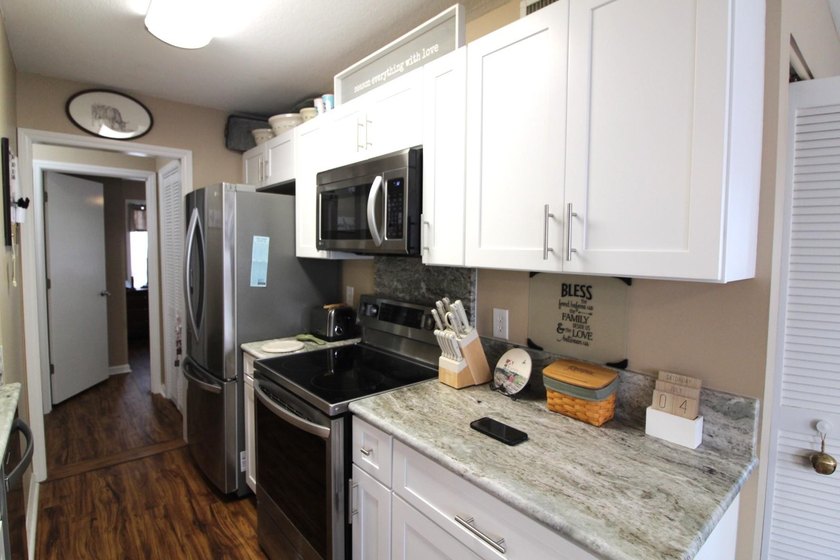 This ground floor 2BR/2BA, end-unit is located in the Tall Oaks - photo 8