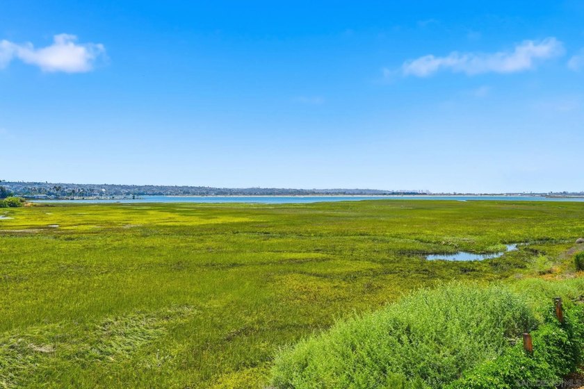 Wake each morning to the gentle shimmer of Mission Bay, where - photo 3