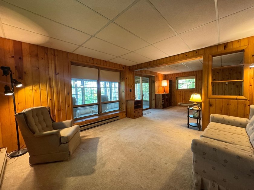 Nestled on a wooded lot on beautiful 204 AC BOOTH lake, this - photo 9