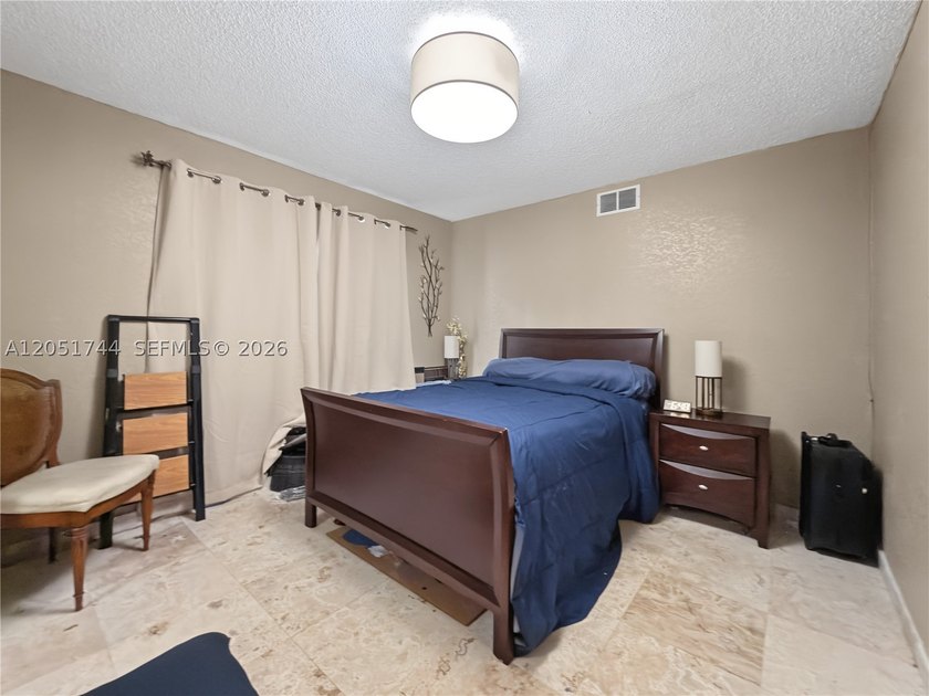 Tucked behind a private, palm-lined entrance in sought-after - photo 13