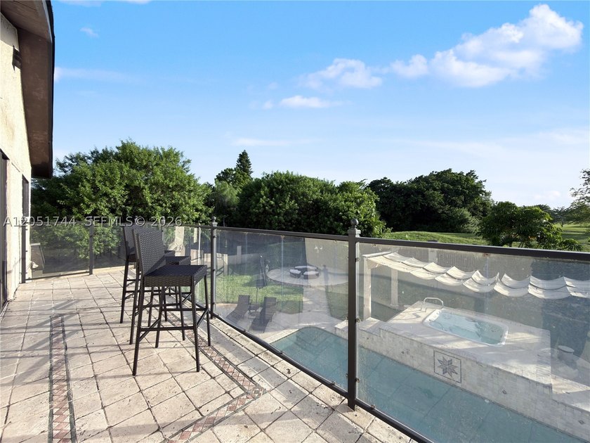 Tucked behind a private, palm-lined entrance in sought-after - photo 20