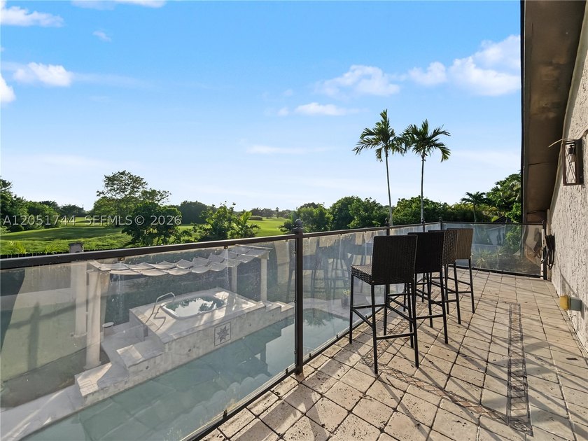 Tucked behind a private, palm-lined entrance in sought-after - photo 21