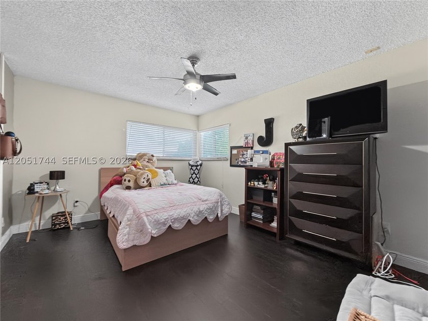 Tucked behind a private, palm-lined entrance in sought-after - photo 24