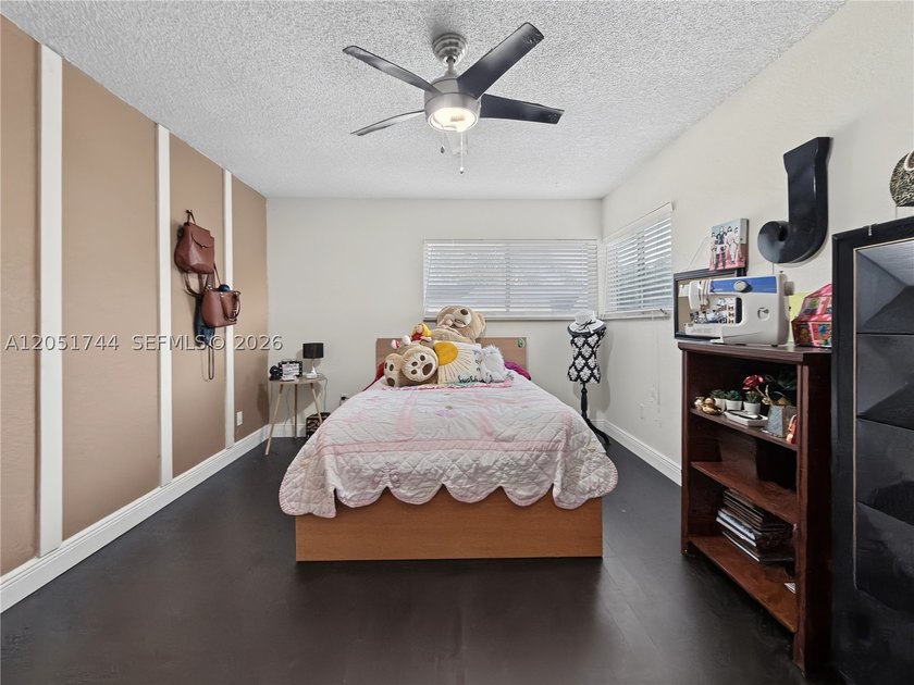 Tucked behind a private, palm-lined entrance in sought-after - photo 25