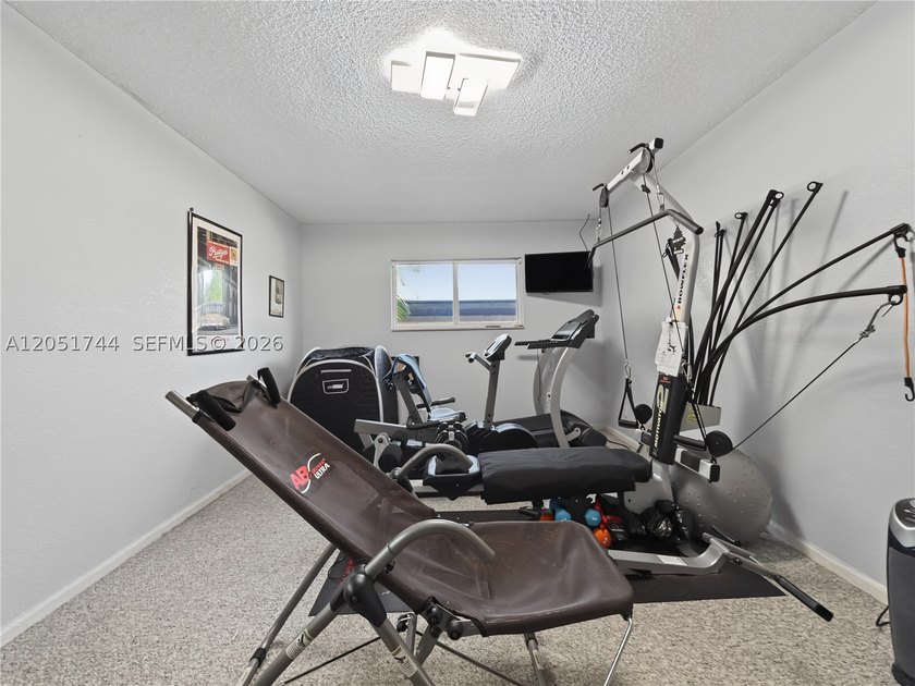 Tucked behind a private, palm-lined entrance in sought-after - photo 26