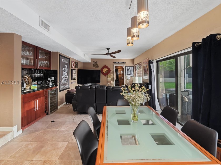 Tucked behind a private, palm-lined entrance in sought-after - photo 32
