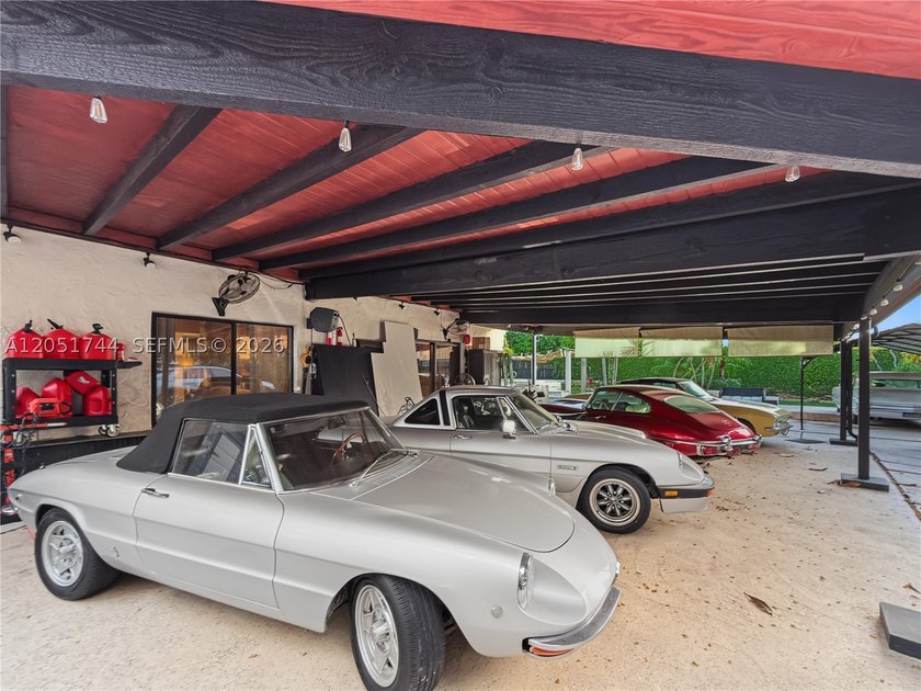 Tucked behind a private, palm-lined entrance in sought-after - photo 39