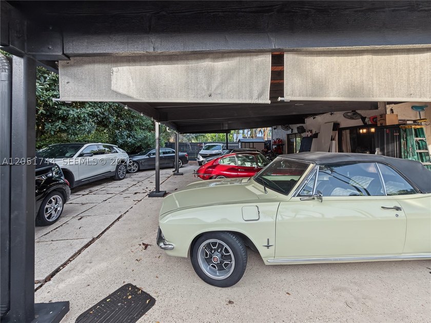 Tucked behind a private, palm-lined entrance in sought-after - photo 40