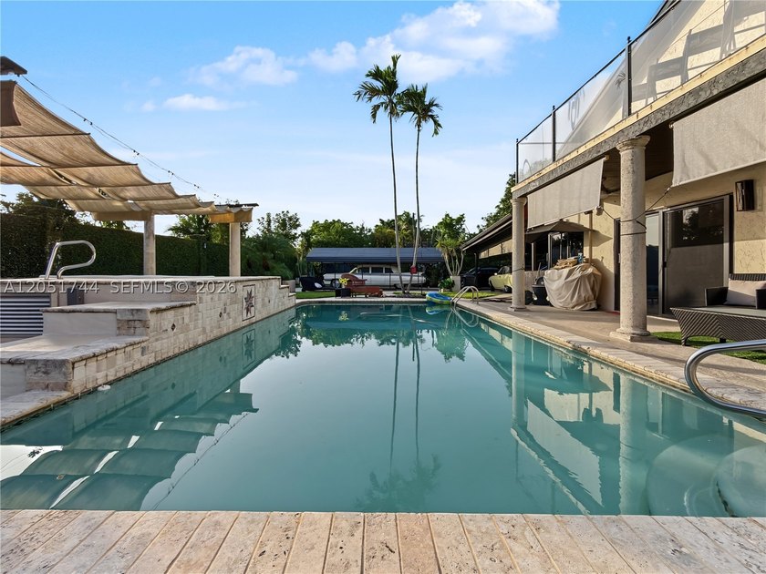 Tucked behind a private, palm-lined entrance in sought-after - photo 42