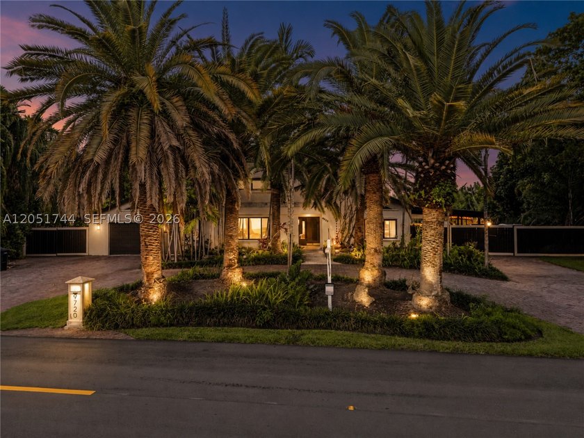 Tucked behind a private, palm-lined entrance in sought-after - photo 45