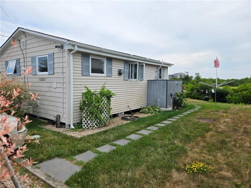 Rare 3 bed 1 bath waterfront cottage on Potter Pond!!! Located - photo 4