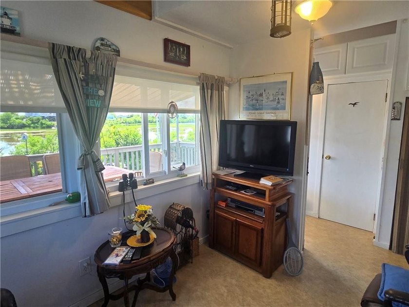 Rare 3 bed 1 bath waterfront cottage on Potter Pond!!! Located - photo 8
