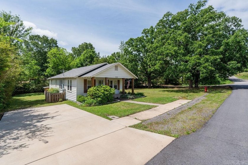 1323 W Searcy Street quietly delivers. Crisp white siding with - photo 2