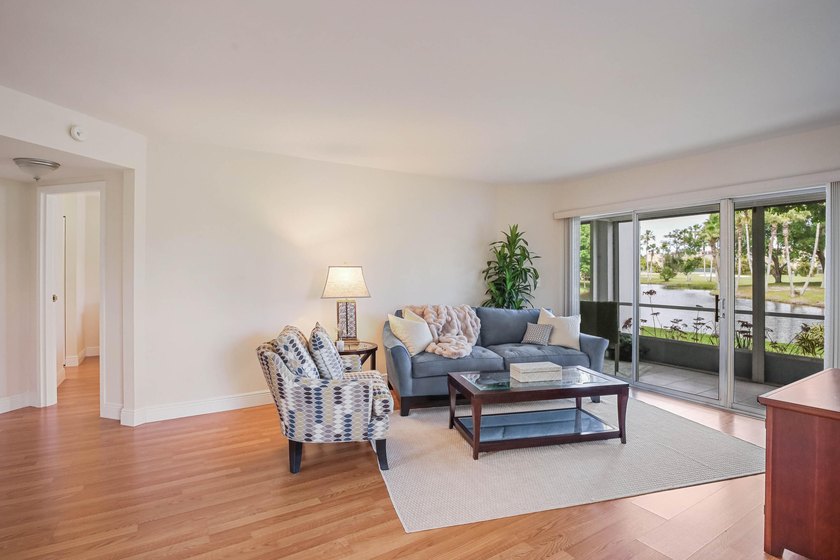 WELCOME TO THIS VERY DESIRABLE CORNER CONDO WITH BEAUTIFUL WATER - photo 2