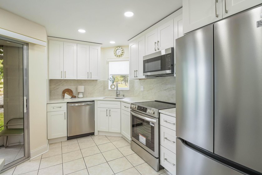WELCOME TO THIS VERY DESIRABLE CORNER CONDO WITH BEAUTIFUL WATER - photo 5