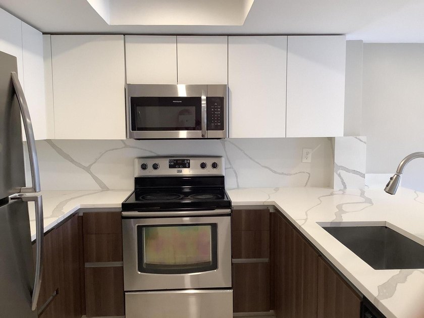 This beautifully renovated 2-bedroom, 2-bathroom townhouse is - photo 2