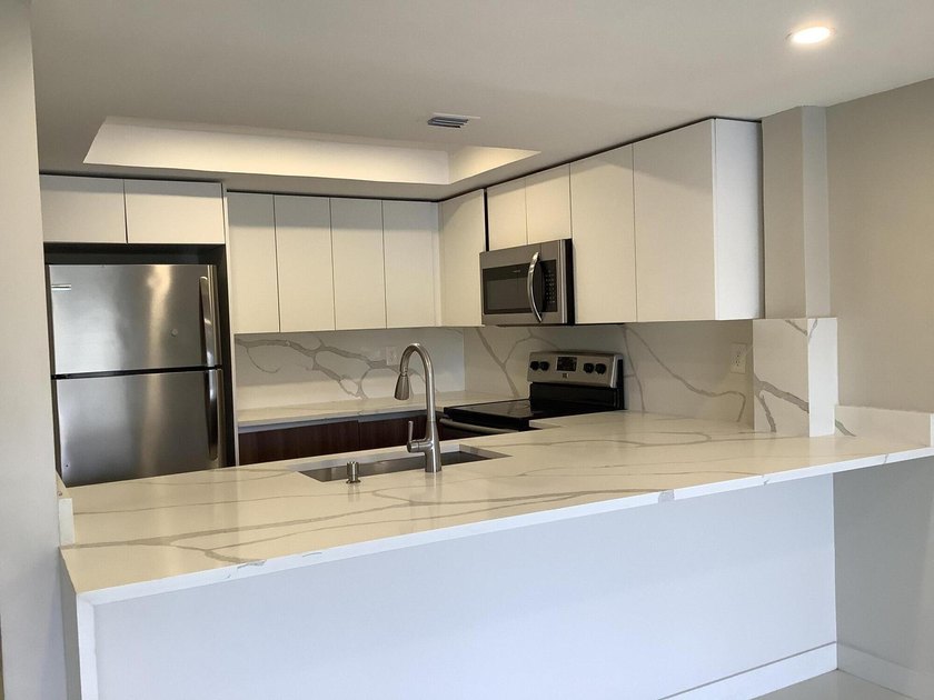 This beautifully renovated 2-bedroom, 2-bathroom townhouse is - photo 5