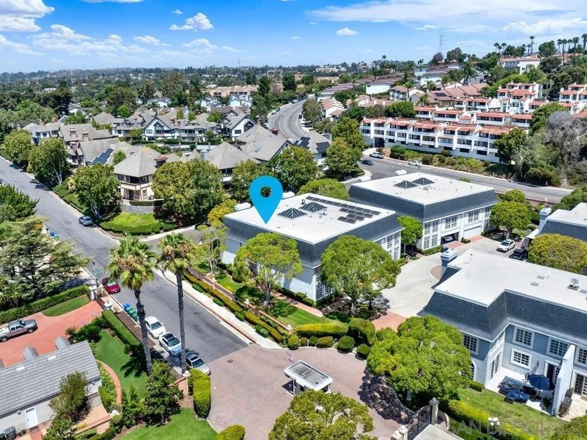 Nestled on a private corner lot within the prestigious gated - photo 2