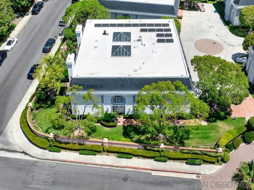 Nestled on a private corner lot within the prestigious gated - photo 5