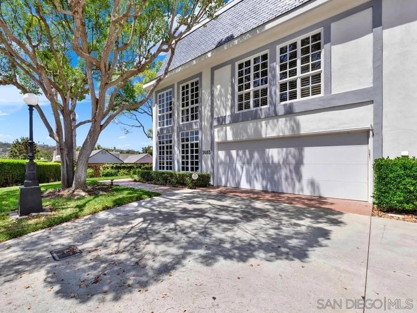 Nestled on a private corner lot within the prestigious gated - photo 7