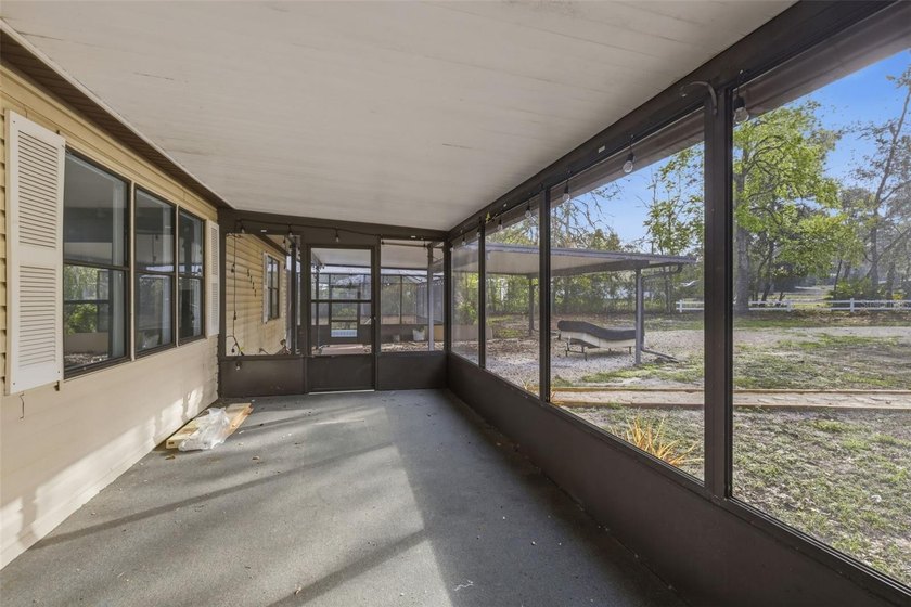 Set on just over half an acre, this 1989 double-wide mobile home - photo 5