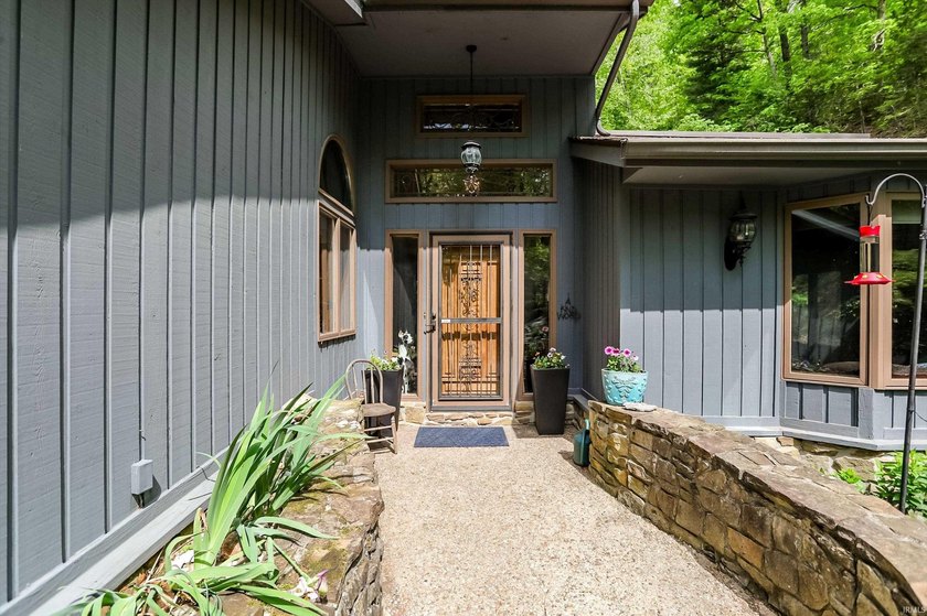Set on nearly 6 wooded acres, this contemporary custom home - photo 3