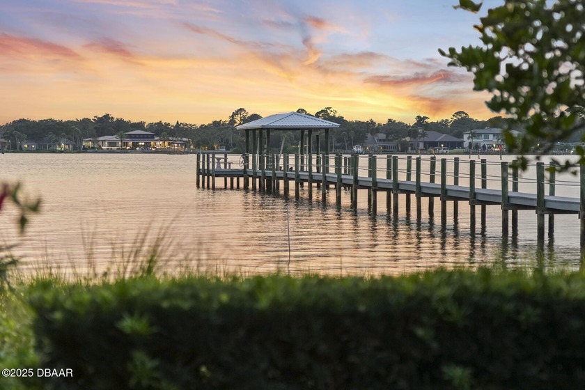 Experience luxurious riverfront living in this striking - photo 2