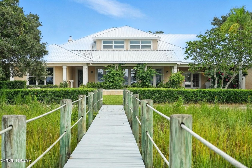 Experience luxurious riverfront living in this striking - photo 3