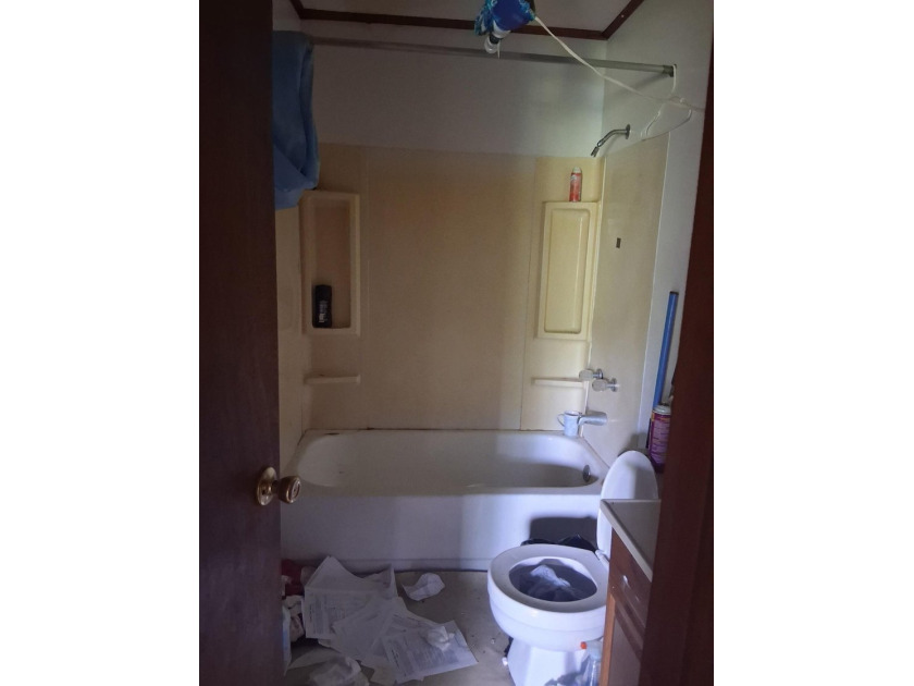 This 4 bedroom 2 bath home is sold AS-IS without appliance and - photo 7