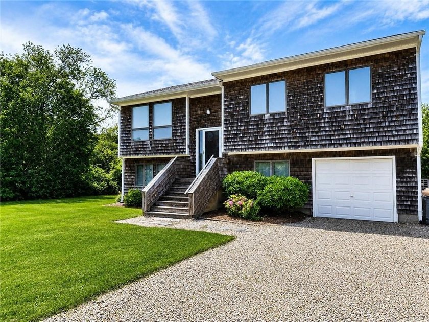 This attractive contemporary raised ranch in popular Eastward - photo 3