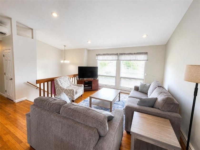 This attractive contemporary raised ranch in popular Eastward - photo 6