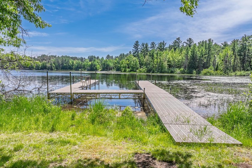 Welcome to this spacious Northwoods waterfront retreat on - photo 2