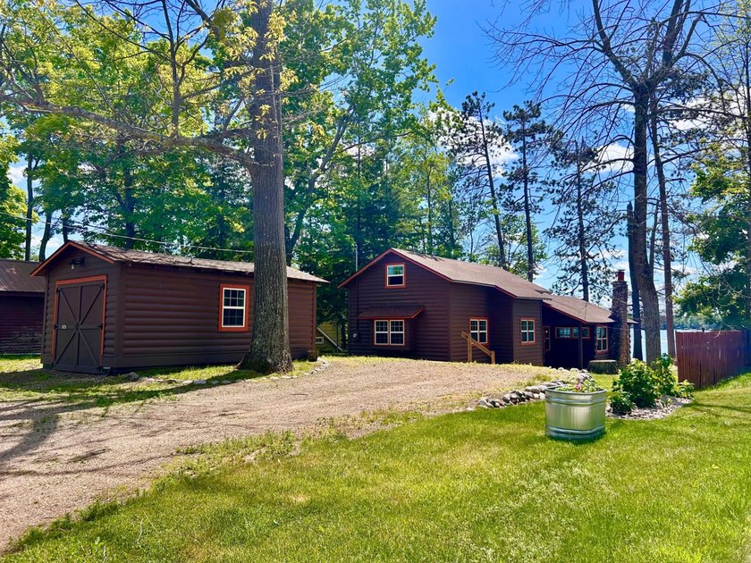 GORGEOUS LAKE HOME WITH PREMIER SANDY FRONTAGE ON - photo 3