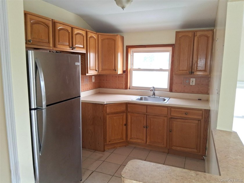 Welcome to this spacious two-family home nestled in the heart of - photo 12