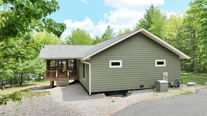Experience waterfront living on Long Lake, part of the renowned - photo 2
