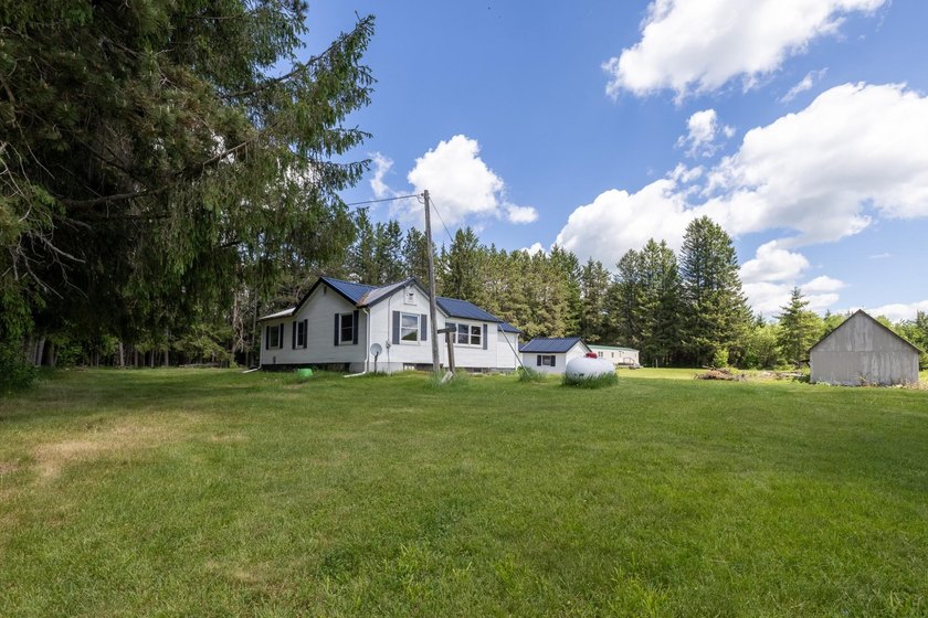 Set on nearly 25 acres along the scenic Deerskin River in Phelps - photo 2