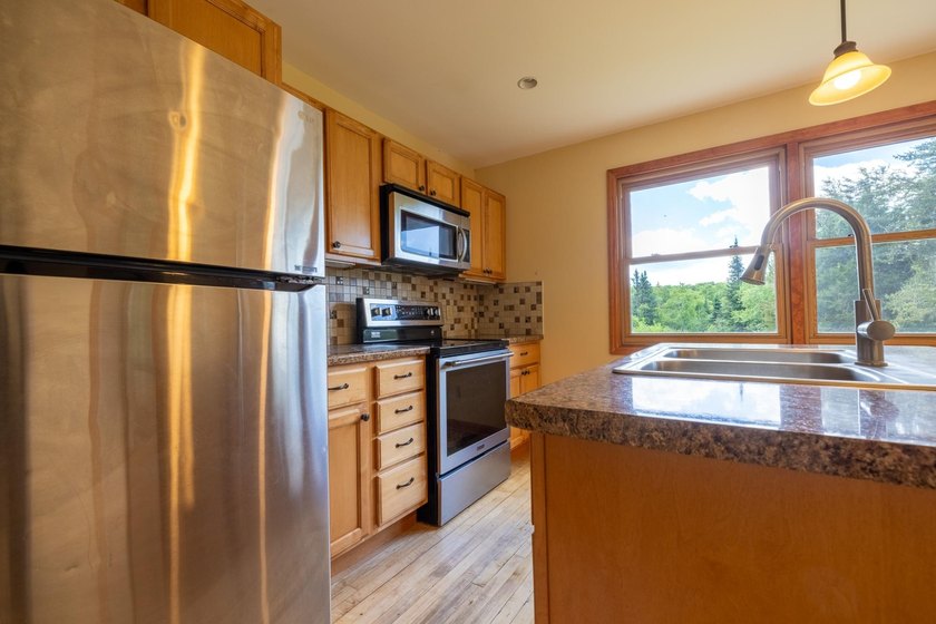 Set on nearly 25 acres along the scenic Deerskin River in Phelps - photo 3