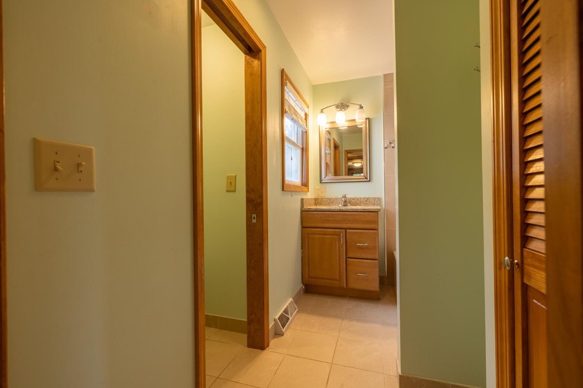 Set on nearly 25 acres along the scenic Deerskin River in Phelps - photo 7