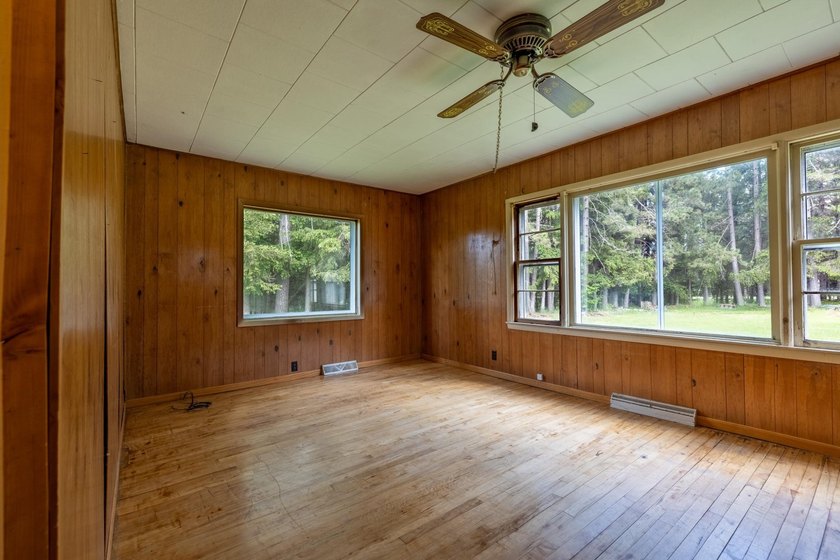 Set on nearly 25 acres along the scenic Deerskin River in Phelps - photo 8