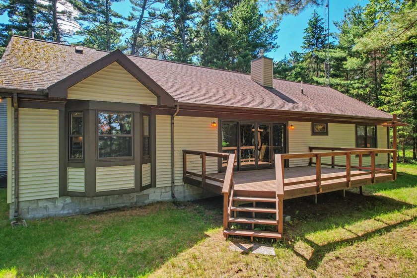 Nestled among towering Northwoods pines on 1.5+ acres, this - photo 4