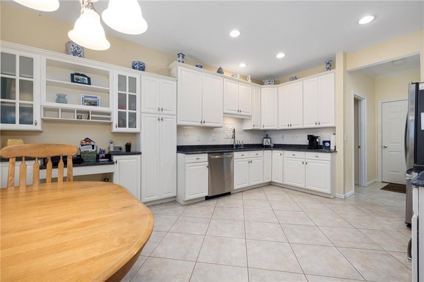 We invite you to explore this expansive end-unit - photo 5