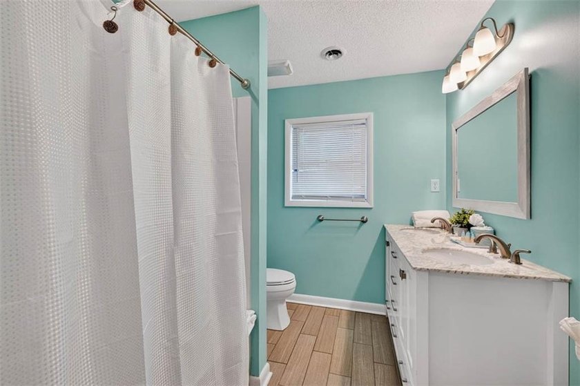 Experience the ultimate in coastal iving with this exceptional - photo 32